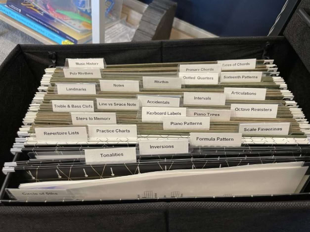 Using file folder drawer to organize piano games